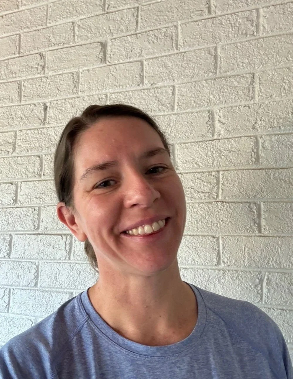 Adrienne, yoga teacher at Ahava Collective, offering accessible and community-centered yoga in Greensboro.