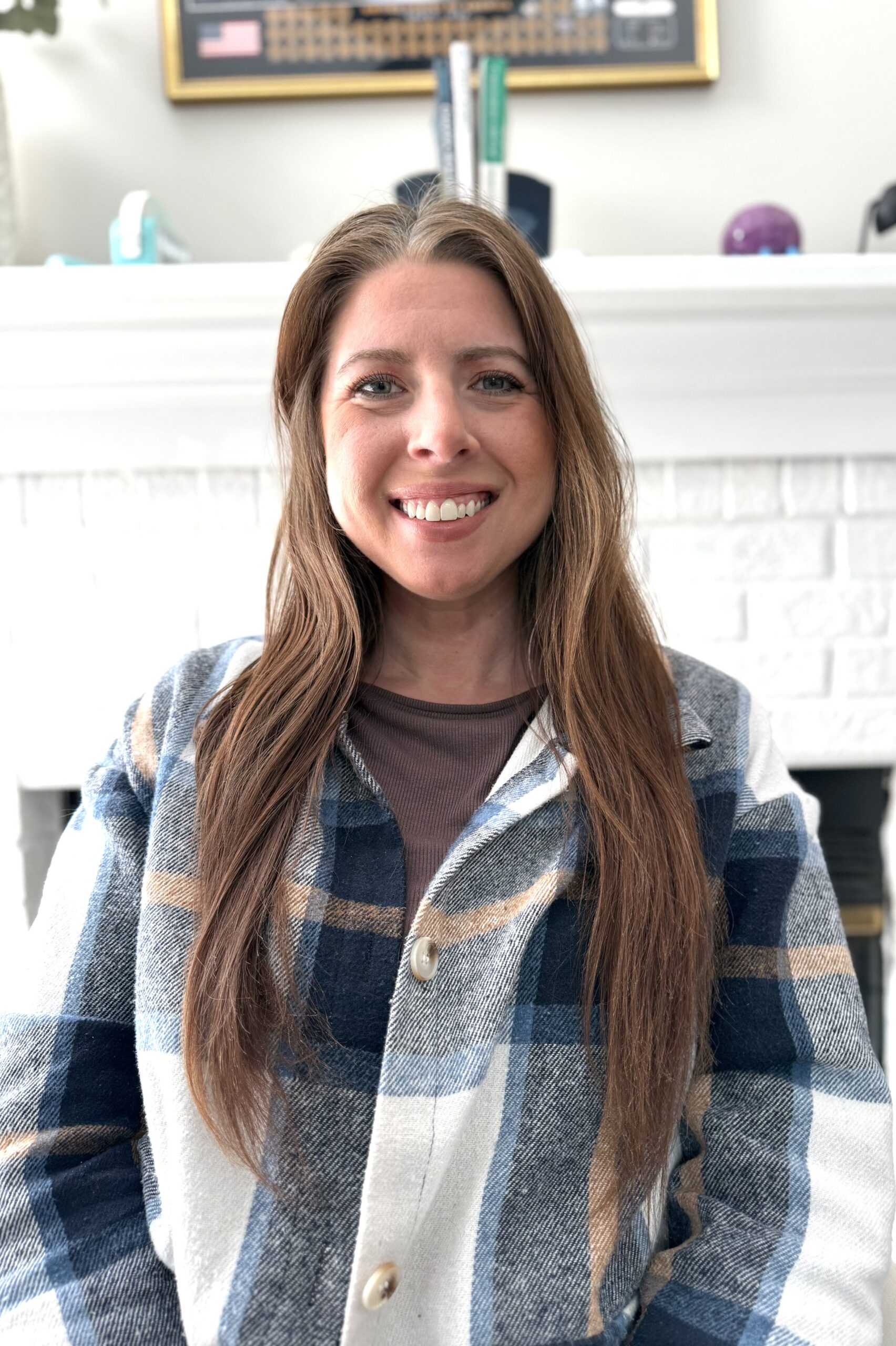 Wellness practitioner standing outdoors in natural setting