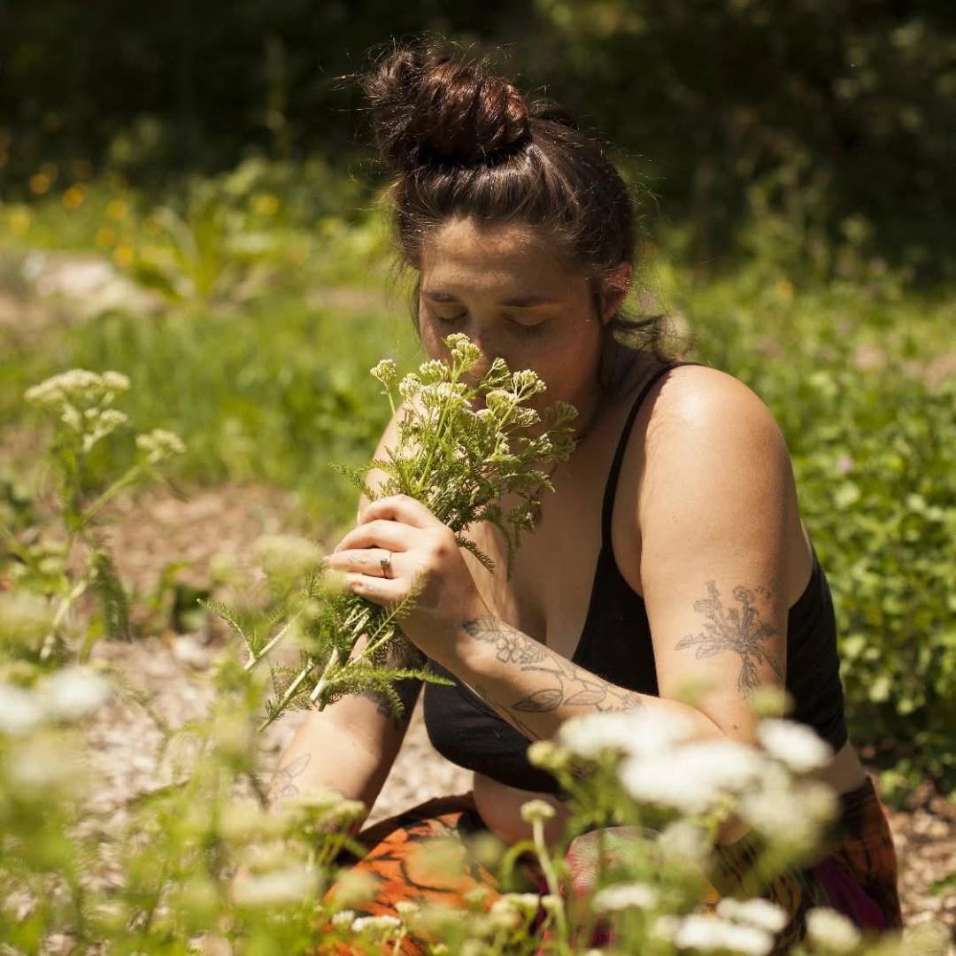 Taylor smelling herbs outdoors